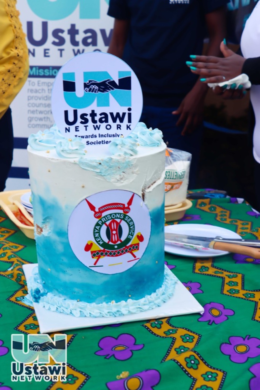 Launch cake featuring Ustawi Network and Kenya Prisons Service symbols.